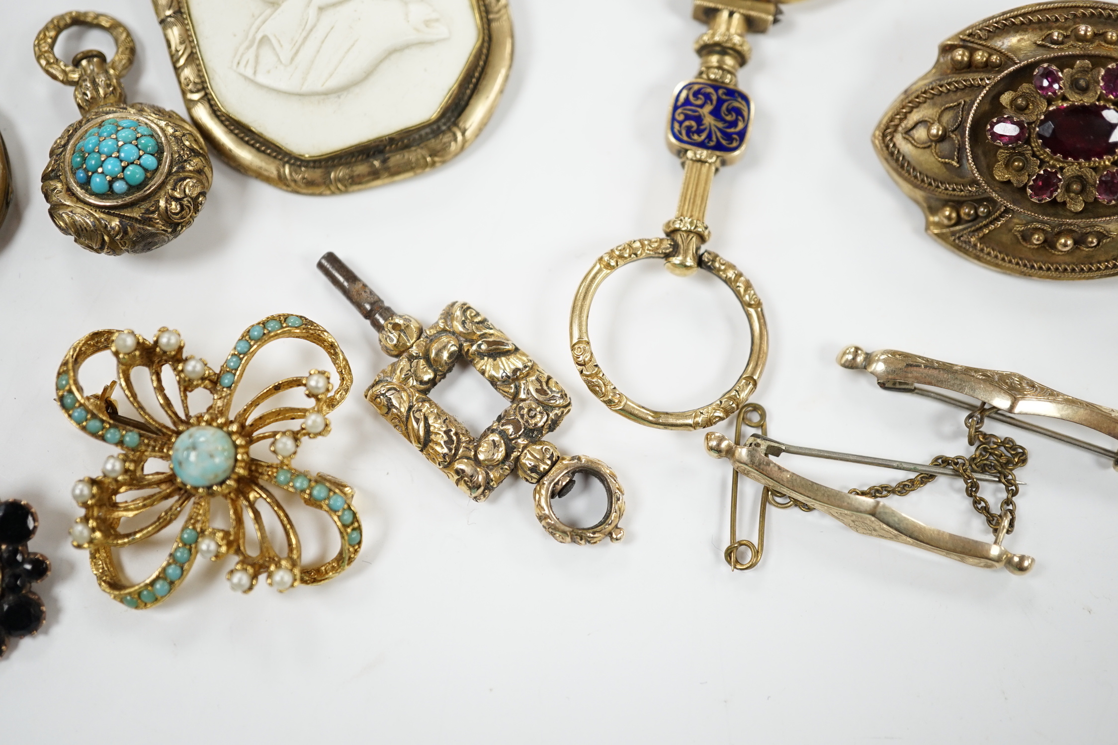Two Georgian yellow metal mourning brooches, including garnet set and other items including garnet set brooch, watch key, eye glass, paste brooch, etc.
